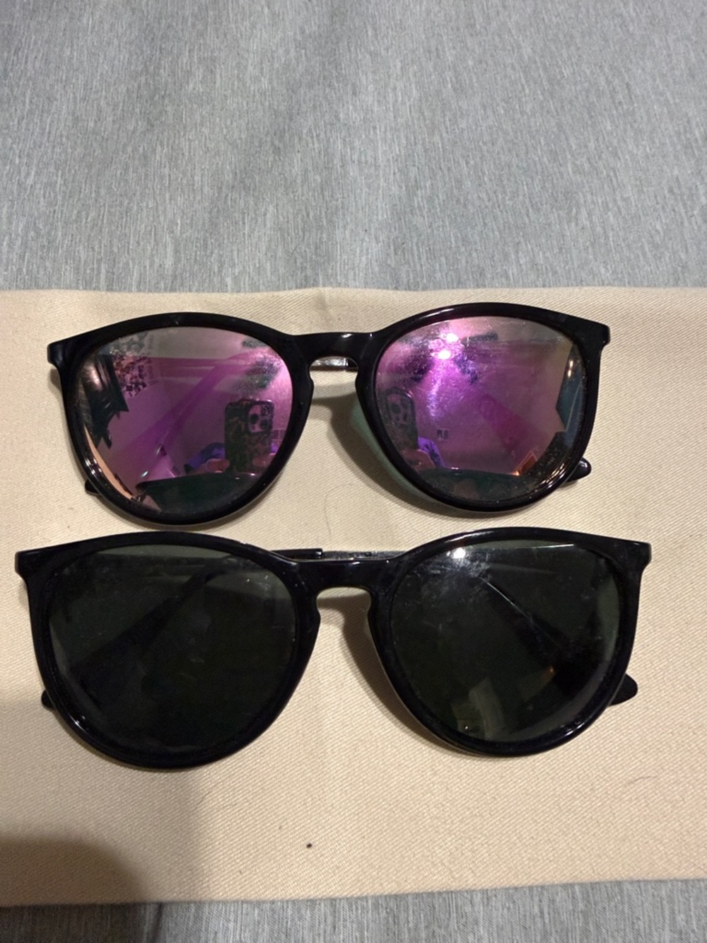 Pair of Black Frame Sunglasses with Pink Mirror and Dark Lenses
